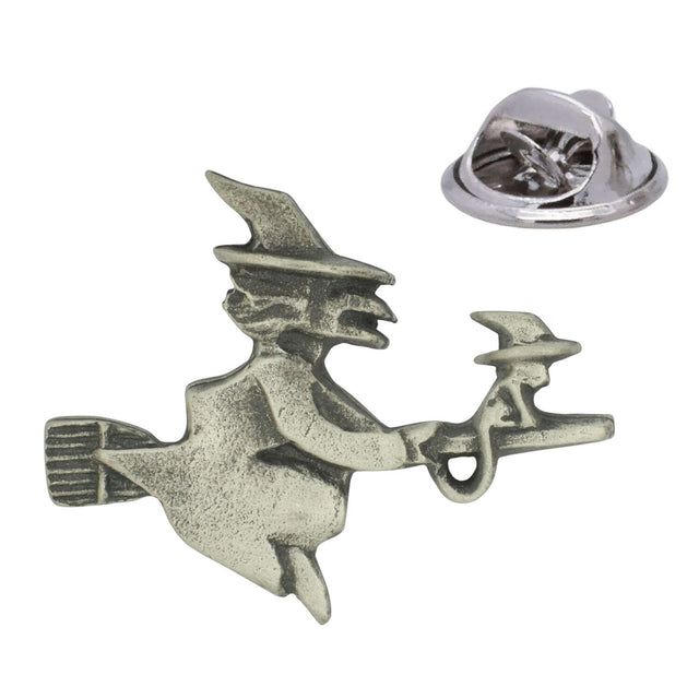 Antique silver-coloured witch and cat flying on a broomstick lapel pin badge with butterfly clasp
