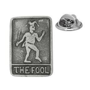 Antique silver-coloured The Fool tarot card lapel pin with jester figure, lettering and butterfly clasp