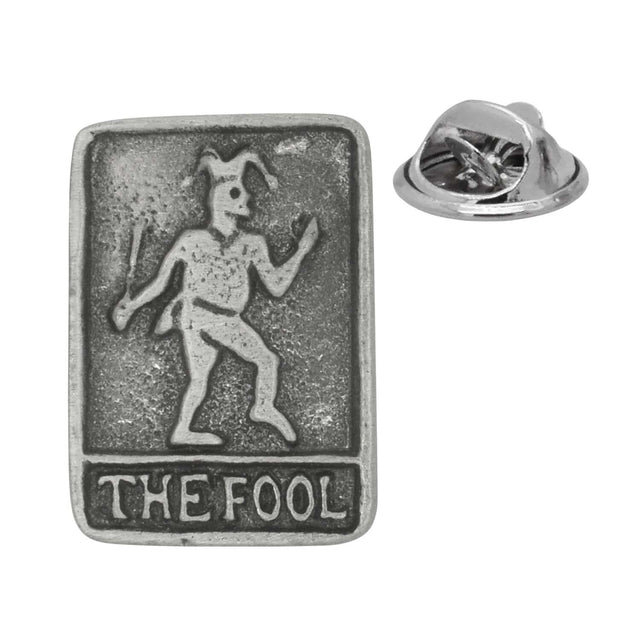 Antique silver-coloured The Fool tarot card lapel pin with jester figure, lettering and butterfly clasp