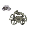 Antique silver-coloured crab lapel pin with raised claws, textured shell, legs and butterfly clasp