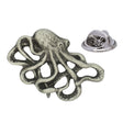 Antique silver-coloured octopus lapel pin badge with curled tentacles and butterfly clasp