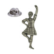 Antique silver-coloured Scottish Highland dancer in tartan kilt with raised arm and butterfly clasp