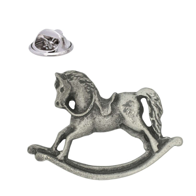 Antique silver pewter rocking horse lapel pin badge showing a traditional toy horse on curved rockers and a butterfly clasp