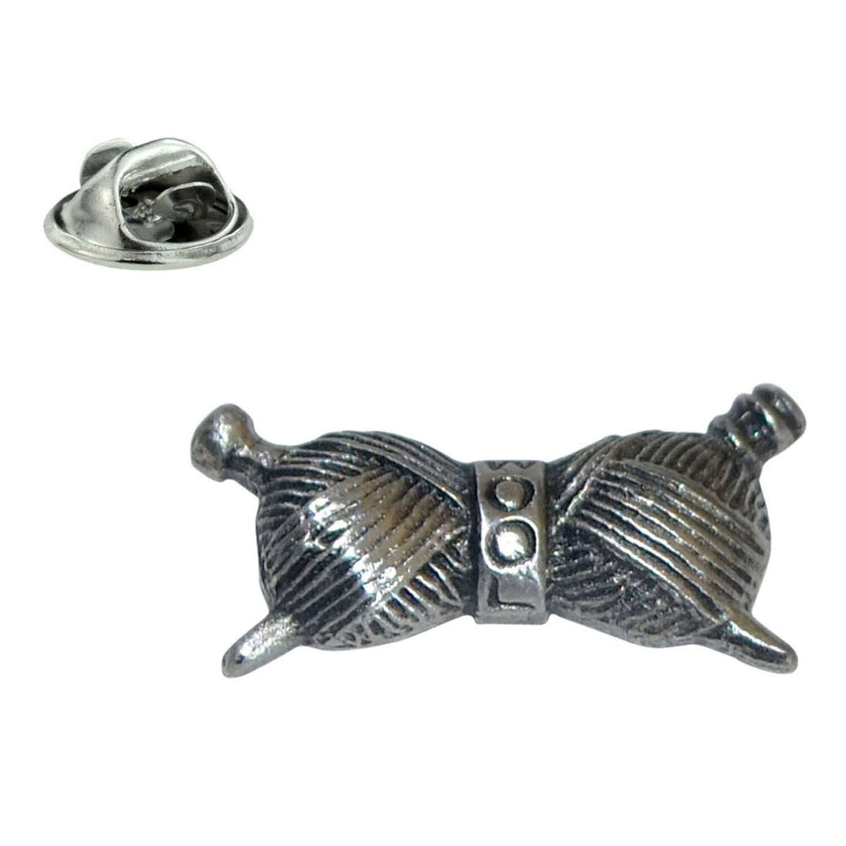 Pewter wool lapel pin badge featuring two crossed balls of yarn with knitting needles and butterfly clasp
