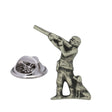 Shooting pewter lapel pin badge showing a standing shotgun shooter with a seated gun dog and butterfly clasp