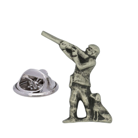 Shooting pewter lapel pin badge showing a standing shotgun shooter with a seated gun dog and butterfly clasp