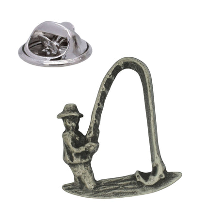 Pewter fishing lapel pin badge depicting an angler holding a curved fishing rod, with butterfly clasp