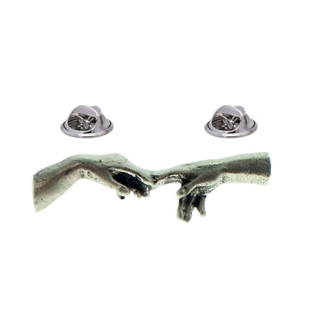 Two reaching hands with fingertips nearly touching, antique silver-coloured pewter lapel pin badge with butterfly clasps