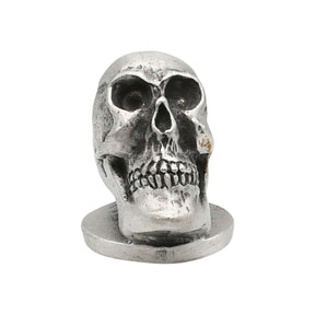 English-made pewter human skull ornament with sculpted teeth and eye sockets front view XDHORN0511