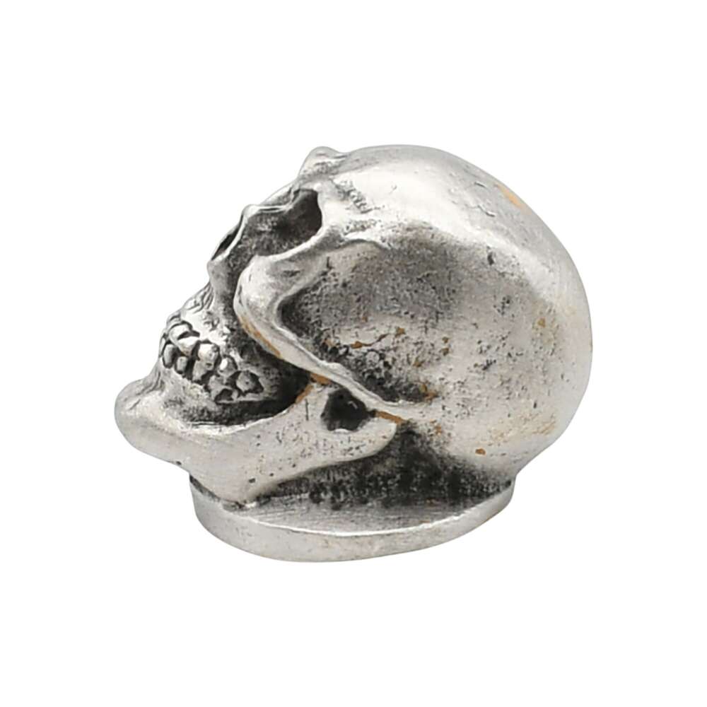 English-made pewter skull ornament on circular base left profile XDHORN0511